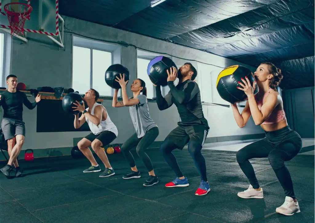 men and women doing wall balls